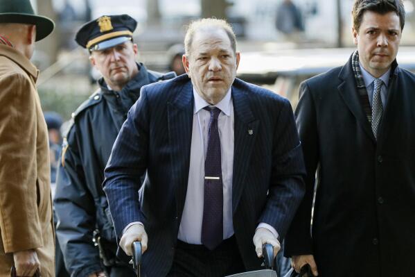 FILE - Harvey Weinstein arrives at a Manhattan courthouse as jury deliberations continue in his rape trial on Feb. 19, 2020, in New York. (AP Photo/John Minchillo, File)